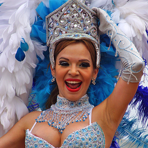 Attractive Latina carnival woman dressed in a green costume